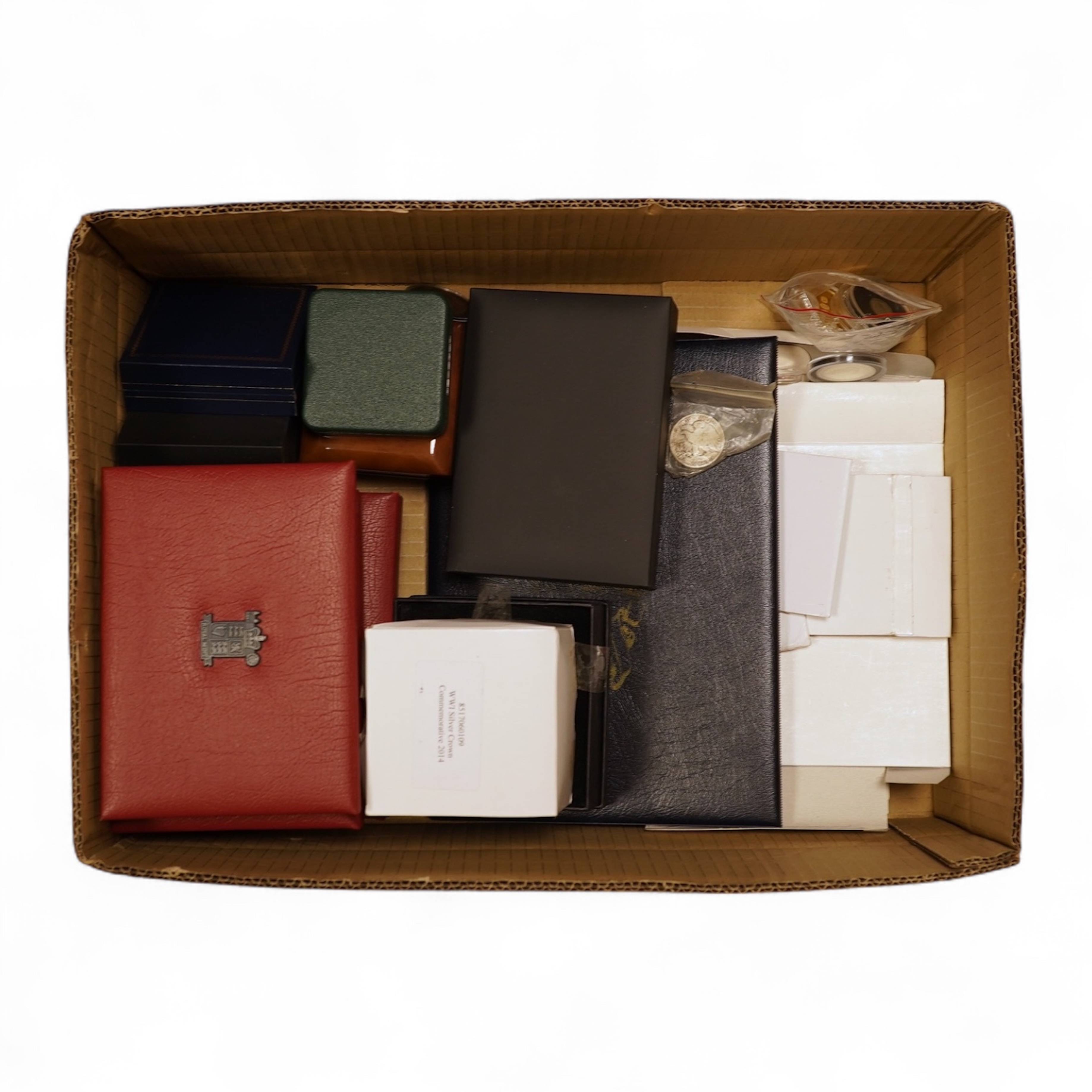 A collection of cased silver and cupro nickel proof and uncirculated sets and coins, including four Royal Mint UK proof coin year sets for 2002-2005, Royal Mint UK silver proof £2, London mint office silver commemorative